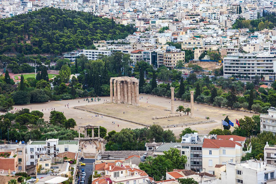 Greek columns, surrounded by the encroaching city, photo by Kyle Thomson