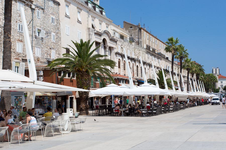 Boardwalk cafes outside the palace walls